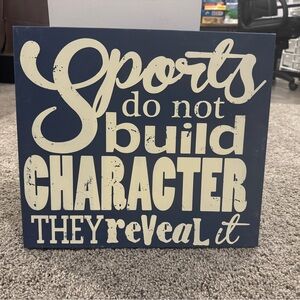 Wooden sign wall art “Sports do not build character, they reveal it”